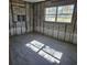 Unfinished bedroom with large windows and tile flooring at 4903 Green Key Rd, New Port Richey, FL 34652
