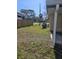 Side yard with AC unit and adjacent to street at 4903 Green Key Rd, New Port Richey, FL 34652
