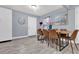 Bright dining area with a rustic wooden table and six leather chairs at 1313 Louisiana St, Plant City, FL 33563