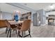 Open concept dining area with modern table and chairs, adjacent to kitchen at 1313 Louisiana St, Plant City, FL 33563