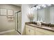 Modern bathroom with double vanity, frameless shower, and stylish decor at 9049 Players Dr, Weeki Wachee, FL 34613