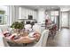 Kitchen and dining area with a round table and seating for six at 9049 Players Dr, Weeki Wachee, FL 34613