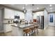 Modern kitchen with white cabinets, stainless steel appliances, and a large island at 9049 Players Dr, Weeki Wachee, FL 34613
