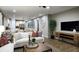 Bright living room with a comfortable sofa and large screen TV at 9049 Players Dr, Weeki Wachee, FL 34613