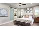 Spacious main bedroom with a king-size bed and an ensuite bathroom at 9049 Players Dr, Weeki Wachee, FL 34613