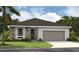 One-story home with stone accents and a two-car garage at 9071 Players Dr, Weeki Wachee, FL 34613