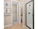 Bathroom with walk-in shower, toilet, and access to a sizable closet at 9093 Players Dr, Weeki Wachee, FL 34613