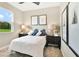 Cozy bedroom with a queen-size bed, two nightstands and large window at 9093 Players Dr, Weeki Wachee, FL 34613