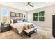 Main bedroom with plush bed, ample natural light, and large windows at 9093 Players Dr, Weeki Wachee, FL 34613