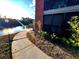 Curved walkway leading to condo with lake and landscaping views at 9100 Dr Martin Luther King Jr N St # 313, St Petersburg, FL 33702