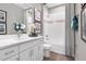 Clean bathroom featuring a white vanity, bathtub, and tasteful decor at 9109 Players Dr, Weeki Wachee, FL 34613