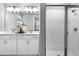 Spa-like bathroom with double vanity and a frameless shower at 9109 Players Dr, Weeki Wachee, FL 34613