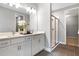 Elegant bathroom boasts double vanity, large mirror, and walk-in shower at 9109 Players Dr, Weeki Wachee, FL 34613