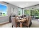 Light and airy dining room with sliding glass doors leading to a patio at 9109 Players Dr, Weeki Wachee, FL 34613