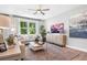 Relaxing living room featuring a neutral color palette and ample natural light at 9109 Players Dr, Weeki Wachee, FL 34613