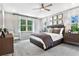 Spacious main bedroom with plush carpeting and plenty of natural light at 9109 Players Dr, Weeki Wachee, FL 34613
