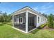 Spacious screened porch and patio area perfect for outdoor dining at 9109 Players Dr, Weeki Wachee, FL 34613
