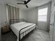 Spacious bedroom with a king-size bed and herringbone-patterned floors at 5046 Avalon Park Blvd, Wesley Chapel, FL 33545
