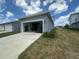 Open garage door revealing interior storage and gym equipment at 5046 Avalon Park Blvd, Wesley Chapel, FL 33545