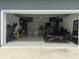 Garage converted into home gym with flooring and equipment at 5046 Avalon Park Blvd, Wesley Chapel, FL 33545