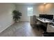 Home office with built-in desk, dual monitors and herringbone floors at 5046 Avalon Park Blvd, Wesley Chapel, FL 33545