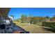 Spacious backyard with a fenced area and trees at 13 Pebble Beach Rd, Rotonda West, FL 33947