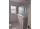 Bathroom with shower and window at 13 Pebble Beach Rd, Rotonda West, FL 33947