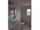 Clean bathroom with a toilet, sink, and bidet at 13 Pebble Beach Rd, Rotonda West, FL 33947