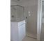 Bathroom with tiled shower and glass enclosure at 13 Pebble Beach Rd, Rotonda West, FL 33947