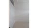 Empty room with white walls, baseboards, and tile floors at 13 Pebble Beach Rd, Rotonda West, FL 33947