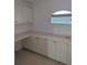 Kitchen with ample cabinetry and countertop space at 13 Pebble Beach Rd, Rotonda West, FL 33947