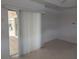 Living room with sliding doors leading to patio at 13 Pebble Beach Rd, Rotonda West, FL 33947