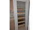 Walk-in pantry with pull-out shelves and ample storage at 13 Pebble Beach Rd, Rotonda West, FL 33947