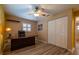 Bedroom with a ceiling fan, a window, and a closet at 8600 W Knights Griffin Rd, Plant City, FL 33565