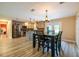 Open concept kitchen features stainless appliances and marble counters attached to a dining area at 8600 W Knights Griffin Rd, Plant City, FL 33565