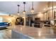 Contemporary kitchen with an eat-in island, modern appliances, and seamless flow into the living area at 8600 W Knights Griffin Rd, Plant City, FL 33565