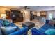 Open-concept living area connected to a modern kitchen, offering spaciousness and seamless flow at 8600 W Knights Griffin Rd, Plant City, FL 33565