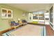 Screened-in porch with wicker chairs, an outdoor rug, and access to the backyard at 8600 W Knights Griffin Rd, Plant City, FL 33565
