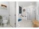 Modern bathroom with soaking tub, walk-in shower, and geometric wall design at 9415 Pinewood Point Pl, Seffner, FL 33584