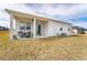 House exterior showcasing patio and backyard at 9415 Pinewood Point Pl, Seffner, FL 33584