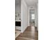 Clean hallway with laundry area and bedroom access at 9415 Pinewood Point Pl, Seffner, FL 33584