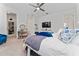 Main bedroom with a large bed, walk-in closet, and ensuite bathroom at 9415 Pinewood Point Pl, Seffner, FL 33584