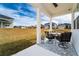 Covered patio with seating area and view of backyard at 9415 Pinewood Point Pl, Seffner, FL 33584