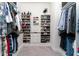 Organized walk-in closet features custom shelves, drawers, and ample space for shoes and clothes at 9415 Pinewood Point Pl, Seffner, FL 33584
