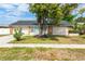 Ranch-style home with stone accents and a two-car garage at 7403 Foxbloom Dr, Port Richey, FL 34668
