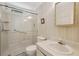 Bathroom featuring a walk-in shower, a toilet, a vanity, and a mirror at 313 Mariner Dr, North Port, FL 34287