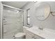 Bathroom features a shower with glass doors, a vanity with sink, and a modern toilet at 313 Mariner Dr, North Port, FL 34287
