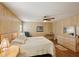 Bedroom featuring wood-look flooring, a ceiling fan, and neutral paint at 313 Mariner Dr, North Port, FL 34287