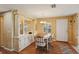 Dining room with wood flooring, a built-in buffet, a table, and four chairs at 313 Mariner Dr, North Port, FL 34287