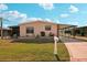 Charming single-story home with well-manicured lawn and covered carport at 313 Mariner Dr, North Port, FL 34287